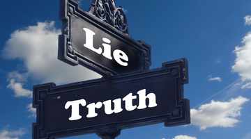 lie and truth signs at an intersection