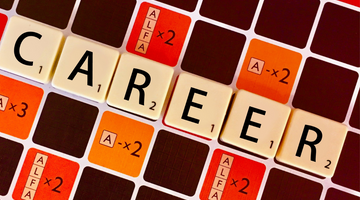 scrabble board spelling the word career
